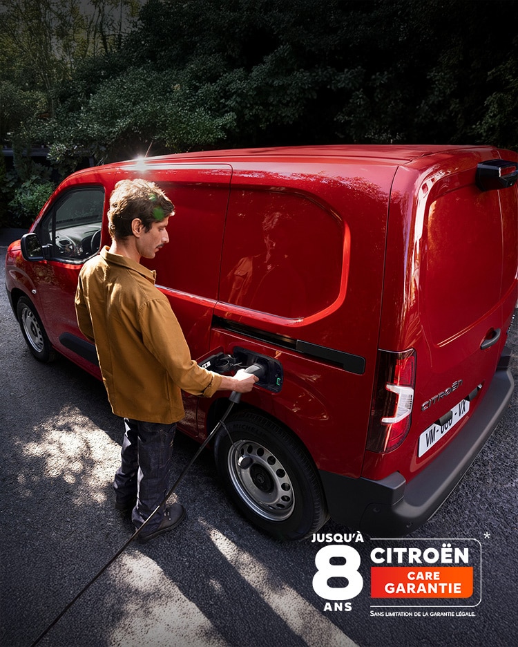 Man charging his red new ë-Berlingo Van