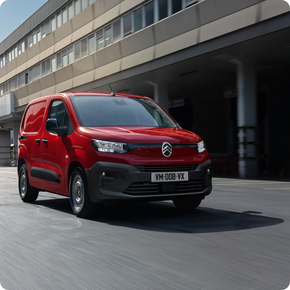 Rear cargo area view of the Citroën ë-C3 Van, highlighting the spacious load compartment, protective bulkhead partition and practical storage capacity.