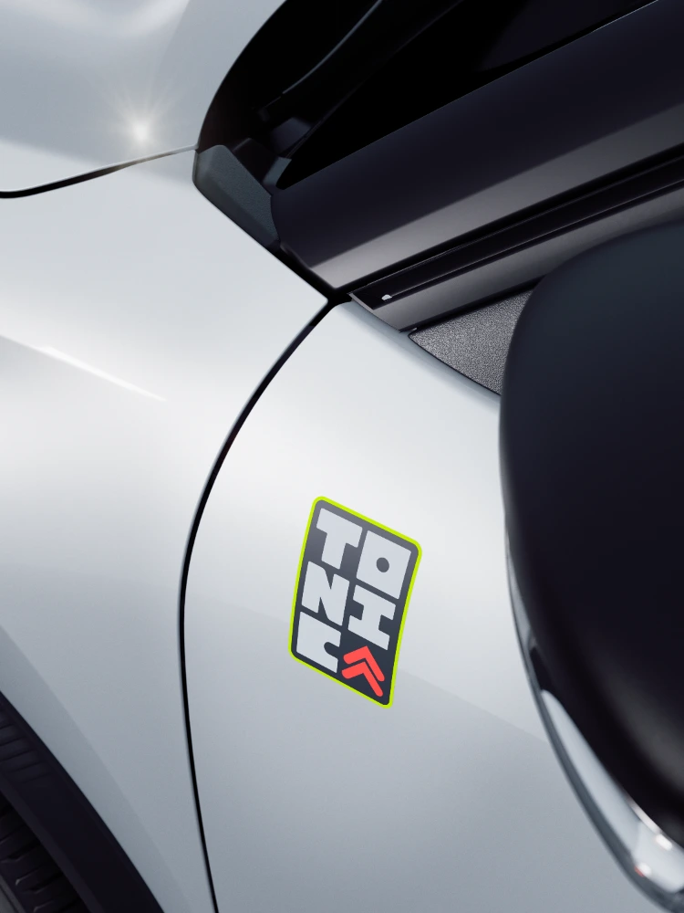 Detailfoto voorkant: Citroën ë-C3 TONIC limited edition elektrische stadswagen met kenmerkende grille en gekleurde sierlijsten, opvallend EV-alternatief