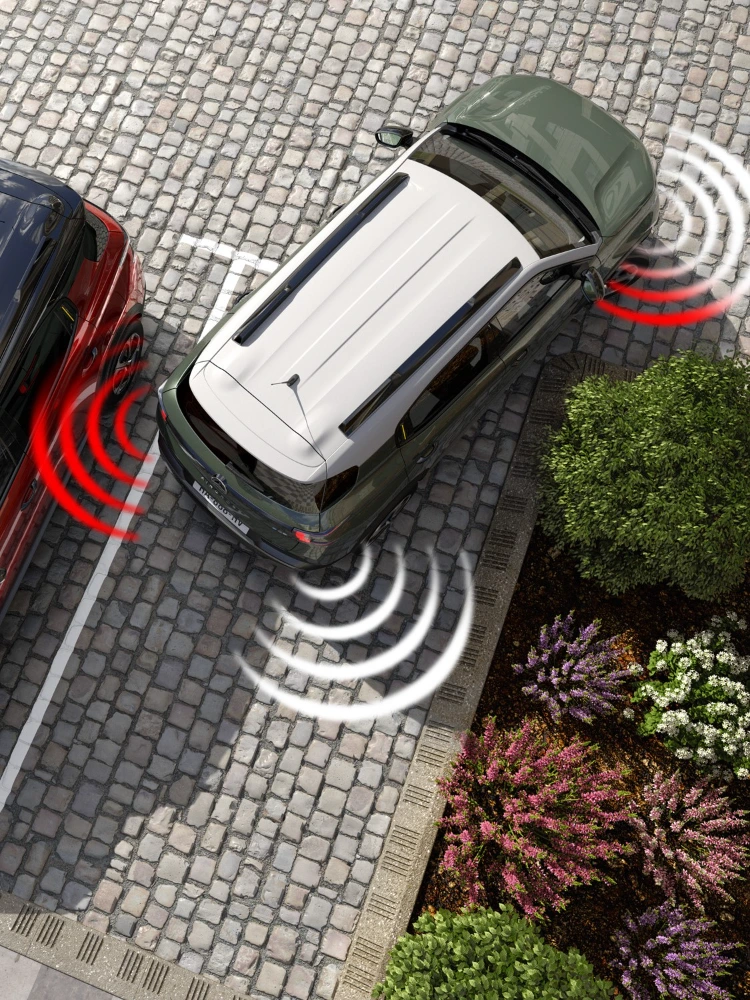 Top-down parkeerweergave van de Citroën ë-C3 Aircross SUV illustreert obstakeldetectie voor veiligere, eenvoudigere en betaalbare dagelijkse manoeuvres.